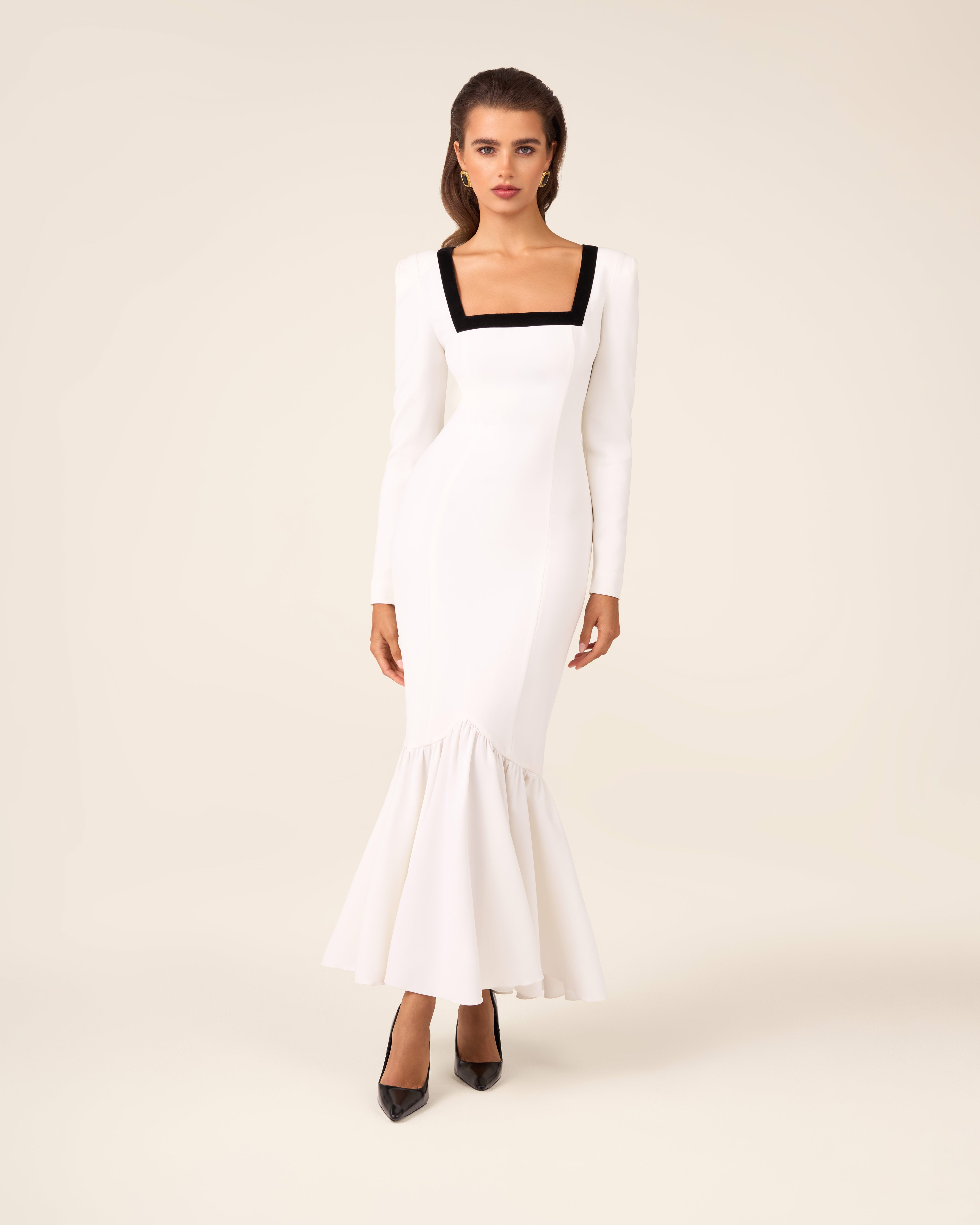Dress with an asymmetric hem and velvet-trimmed neckline